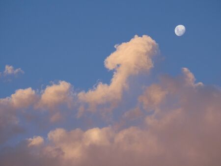 Moon with Clouds at Sunsetの写真素材