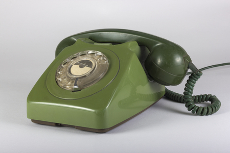 old green telephone isolated on white backgroundの写真素材