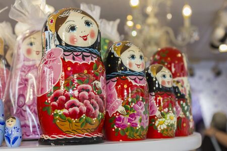 abu dhabi, united arab emirates-April 14, 2018: A lot of Matryoshka at souvenir market shop. Different colors Russian dolls. Traditional classic Russian handicraft art background. Famous classical and modern Russian dolls Matryoshka toysのeditorial素材