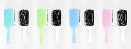 Beautiful trendy Big set of plastic hair brushes different color isolated on white background front and back viewの写真素材