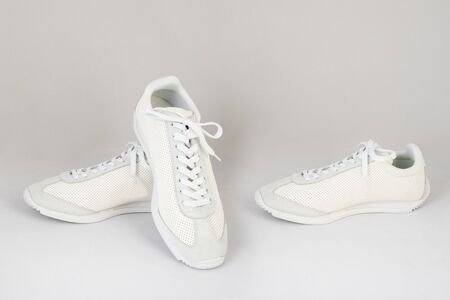white sneakers shoes isolated on white background side and front viewの写真素材