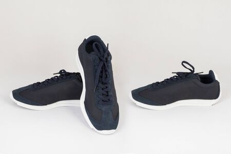 dark blue sneakers shoes isolated on white background side and front viewの写真素材