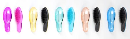 Beautiful trendy Big set of plastic hair brushes different color isolated on white background front and back viewの写真素材