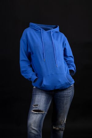 Empty clothes invisible sexy Woman wearing blue hoodie and tight jeans posing front viewの写真素材