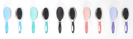 Beautiful trendy Big set of plastic hair brushes different color isolated on white background front and back viewの写真素材