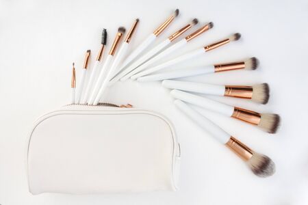 set of make-up brushes, shot on white background grouped together and counterbalanced by a larger powder brushの写真素材