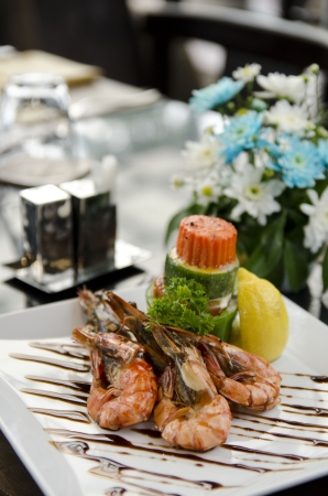 grilled shrimp with lemon and sauceの写真素材