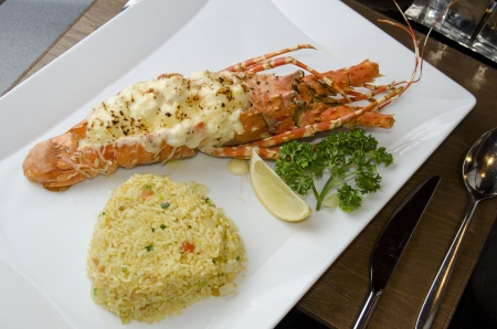 lobster with parsler , slice lemon and curry fired riceの写真素材