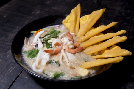 Seafood in gravy soup with fired dumplingの写真素材