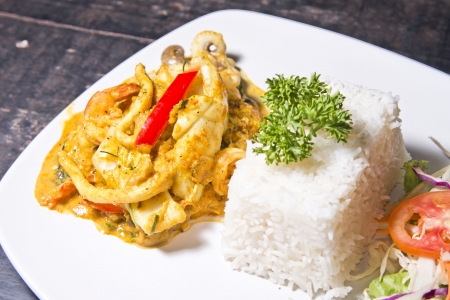 Spicy curry seafood with stream rice, Thai foodの写真素材