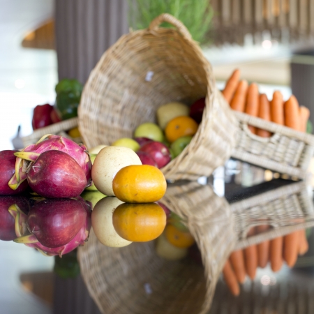 fruits and carrots in basketの写真素材