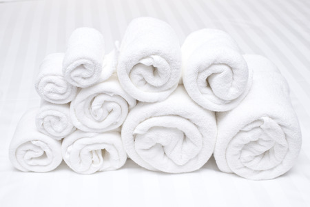 white towel on bedの写真素材