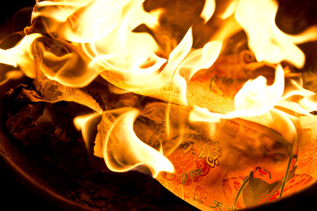 Phuket, THAILAND-FEB 10 :: Chinese New Year - people burnt fake money for ancestor Beliefs of the Chinese people on February 10, 2014 in Phuket, Thailandのeditorial素材