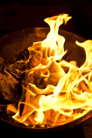 Phuket, THAILAND-FEB 10 :: Chinese New Year - people burnt fake money for ancestor Beliefs of the Chinese people on February 10, 2014 in Phuket, Thailandのeditorial素材