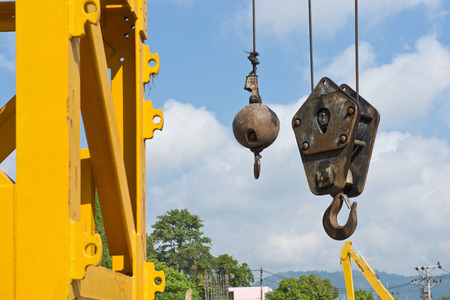 Yellow Derrick rigs is working in nice day and blue skyの写真素材
