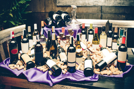 so many wine bottle and cork on the table, vintage style colorの写真素材