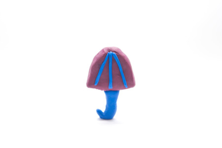a little unbrella made by clay isolate on white backgroundの写真素材
