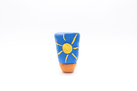 a little sun block made by clay isolate on white backgroundの写真素材