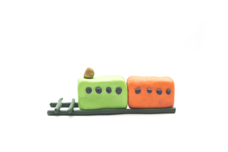 a little train made by clay isolate on white backgroundの写真素材