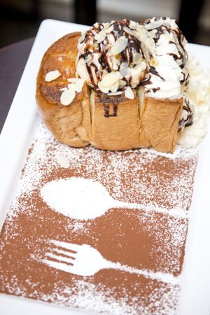 Honey toast with ice-cream and whipped creamの写真素材