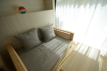 Shadow from shining through a window and the curtains, white roomの写真素材