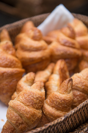 delicious croissant in basket, breakfastの写真素材