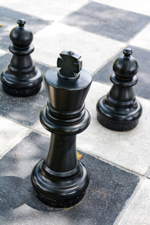 Big plastic chess game on checkerboard, playの写真素材