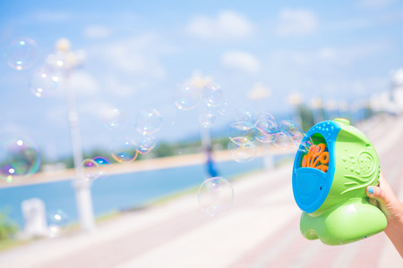play bubble machine toy for kid in nice dayの写真素材