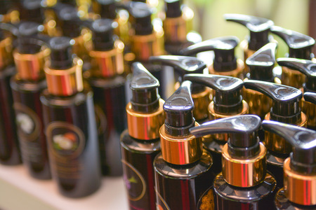 brown plastic bottle for shampoo, hotel