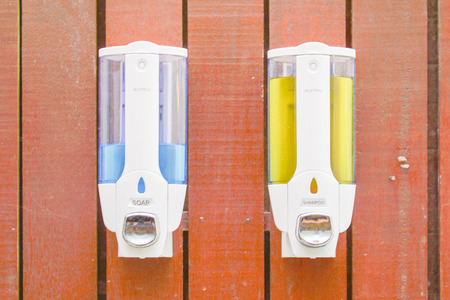 shampoo and soap dispenser pump on wall, cosmetic