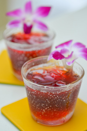 Roselle juice with orchid, welcome drinkの写真素材