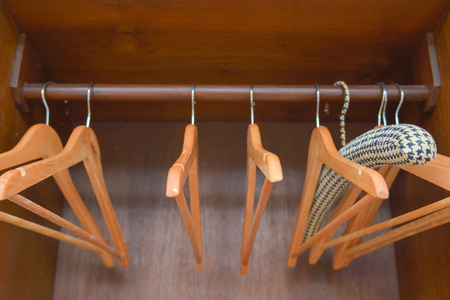 Wooden hangers in the closet, wardrobeの写真素材
