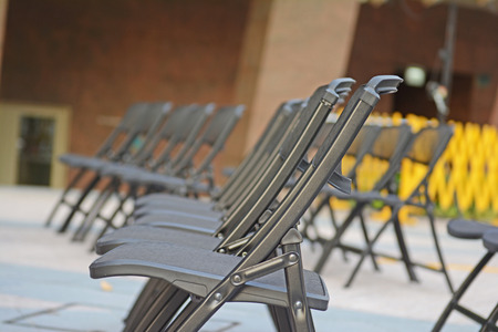 Chairs arranged in a conference room, folding chairの写真素材