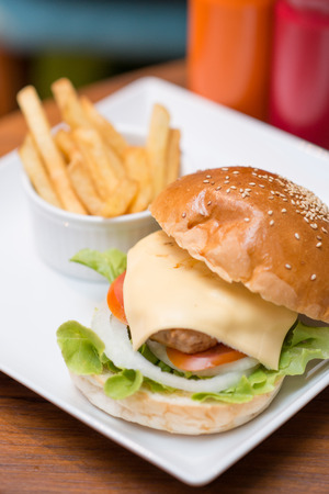 Big burger pork and cheese serve with French fries, Foodの写真素材