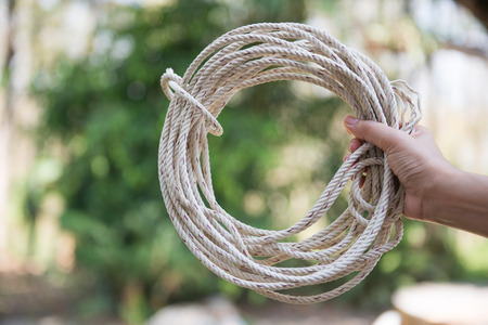 hand holding rope for a bundle, lassoの写真素材