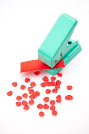 green paper punches with red paper, toolの写真素材