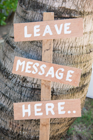 Leave message here wood lebel in garden, textの写真素材