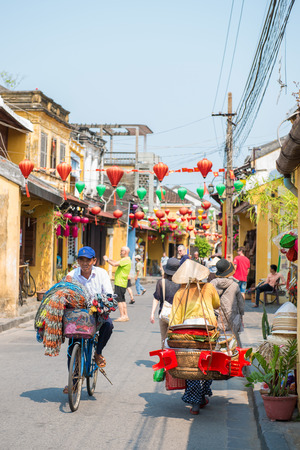 Hoi An - Vietnam Mar 16 :  vietnamese is cycling bicycle in Hoi An ancient town on Mar 16, 2015 Vietnamのeditorial素材