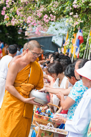 Thailand 13 Apr :: give alms to a Buddhist monk in Songkran Festival , on 13 April 2015 Thailandのeditorial素材