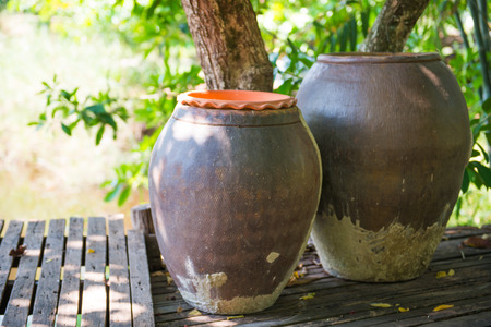 Thai jar in wood home, containerの写真素材