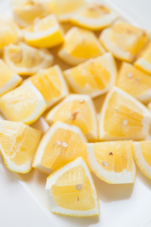 fresh lemon on white dish, sourの写真素材