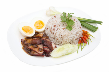 rice with roasted red pork and egg on white background, foodの写真素材