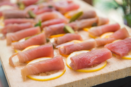 slice smoked tuna on lemon for dining, foodの写真素材