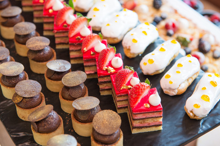 various dessert with fresh fruit on buffet line, sweet various dessert with fresh fruit on buffet line, sweet