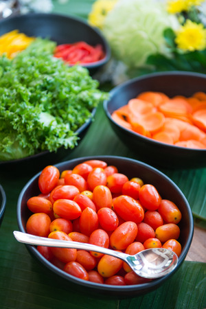 fresh tomatoes and vegetable for salad in bowl, healthyの写真素材