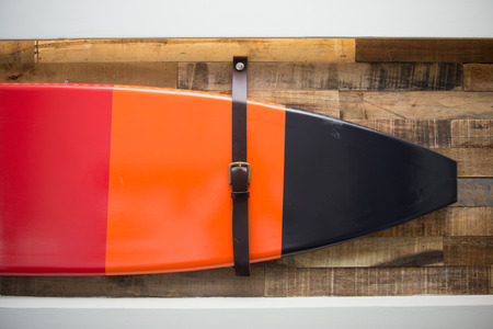 beautiful surf board hang on the wood wall, home decorの写真素材