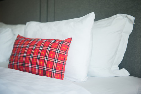 white pillows on the bed in bedroomの写真素材