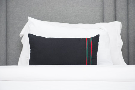white pillows on the bed in bedroomの写真素材