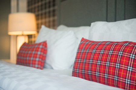 white pillows on the bed in bedroomの写真素材