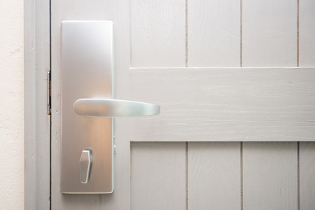 white the door with metal handle, lockの写真素材